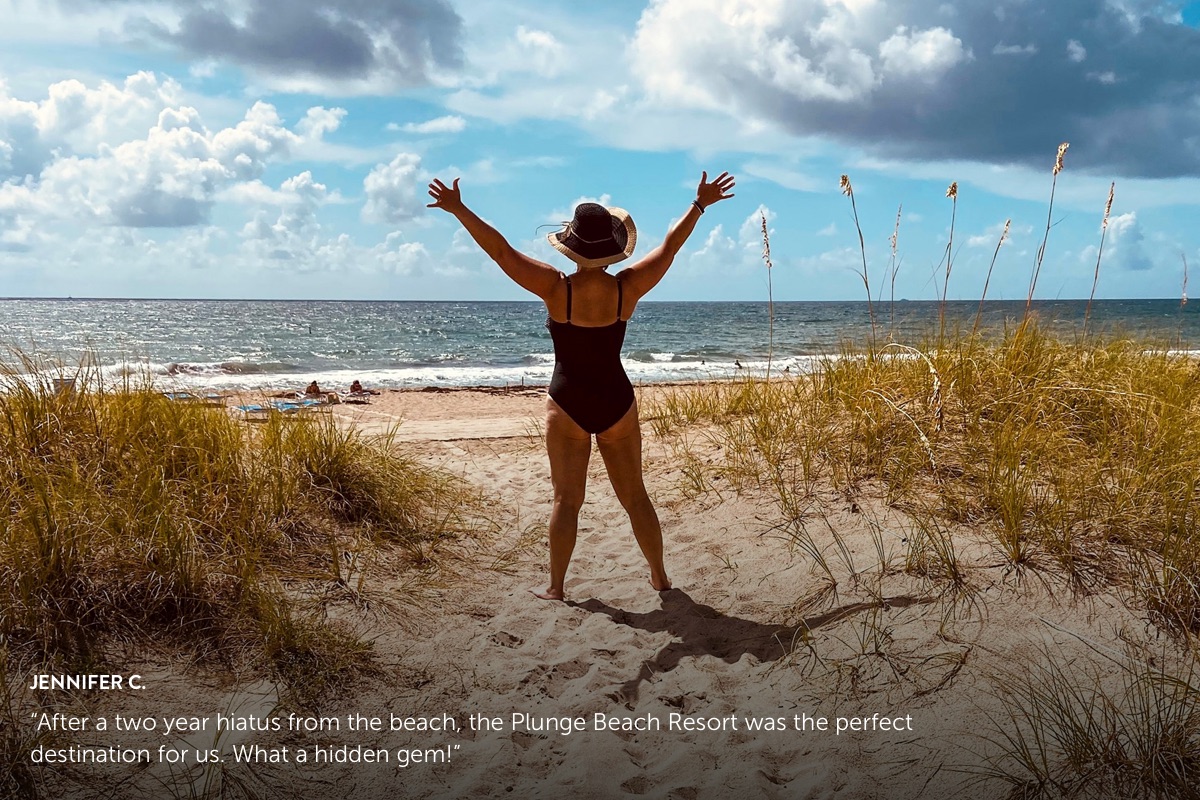 Photo submission from Jennifer C. showing a woman at the beach with hands outstretched looking out onto the ocean.