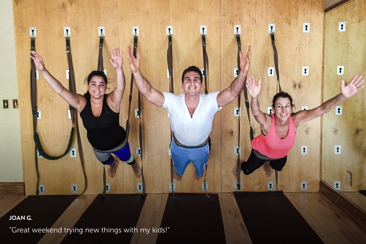 Photo submission from Joan G., showing a dad and daughters doing a workout at the Woodloch gym