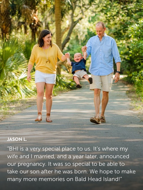 Photo submission from Jason L., showing a man and woman walking on a path swinging their toddler son.